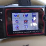 OBD2 scanner displaying diagnostic information