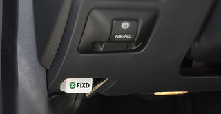 Fixd OBD2 adapter connected to a car's OBD-II port