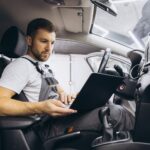 Mechanic Checking OBD on Laptop