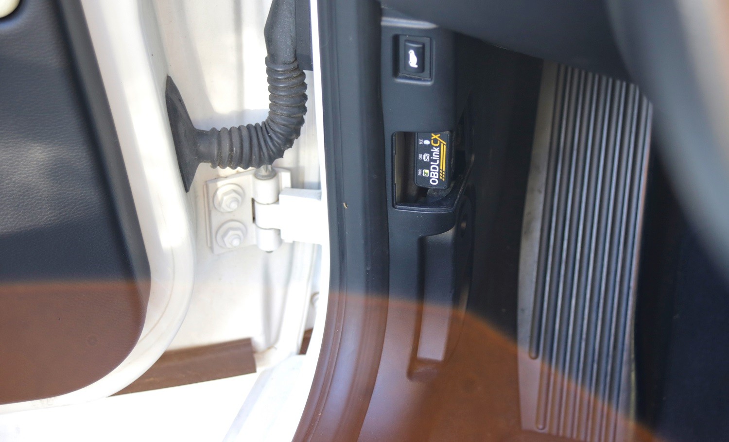 OBDLink CX scanner connected to BMW 128i OBD2 port
