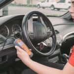AutoZone employee using fix finder to diagnose check engine light