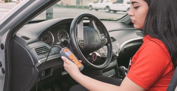 AutoZone employee using fix finder to diagnose check engine light