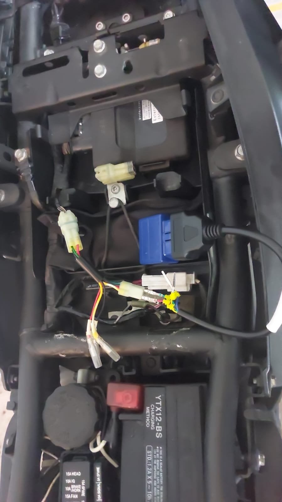 Prototype of an OBD2 socket for testing, showing the lead connections for diagnostics.