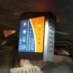 Trekpow OBD2 scanner connected to a car's OBD2 port, illustrating the connection process