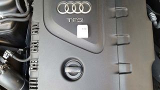 Mechanic using an OBD2 scanner to diagnose a car problem